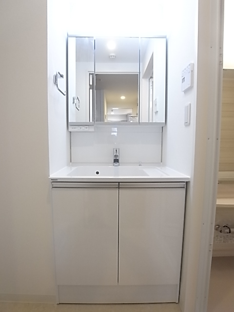 Washroom. Vanity of three-sided mirror