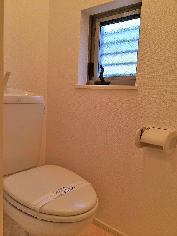 Toilet. There is a window in the toilet