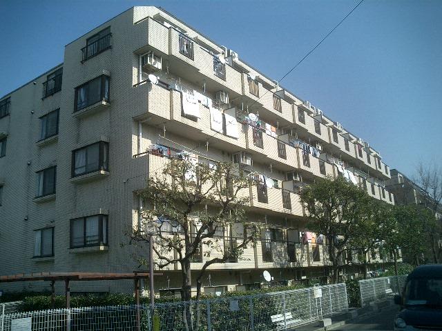 Local appearance photo. Low-rise apartment nestled in a quiet residential area