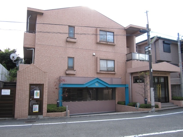 Building appearance. Parking under the building