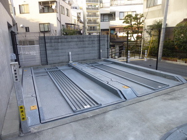 Parking lot. There is a parking lot behind