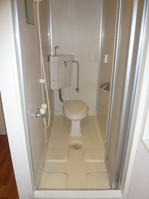Toilet. Sharing a room with shower room