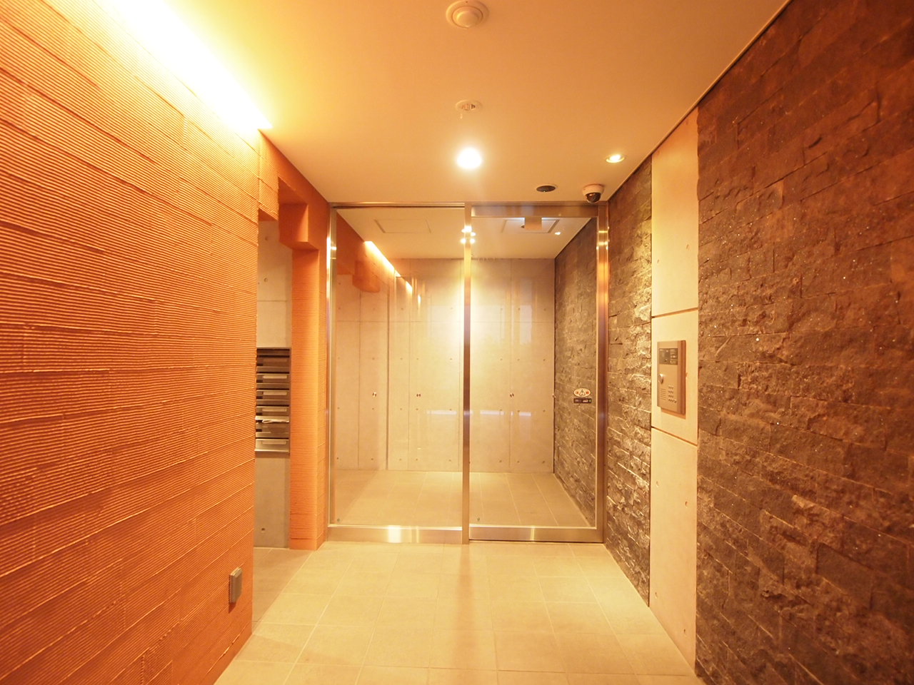 lobby. Entrance classy surrounded by a stone stuck in the wall