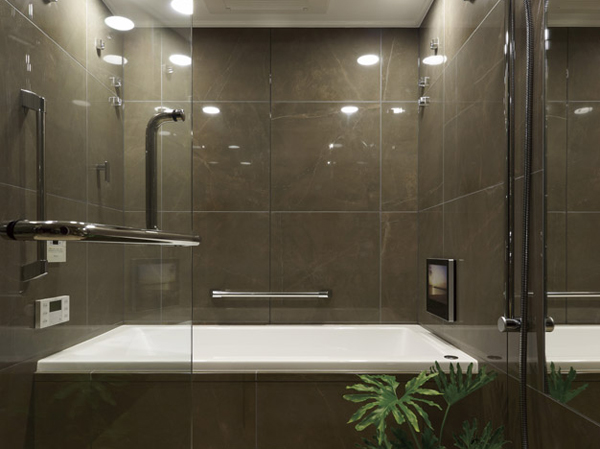Bathing-wash room.  [BATHROOM] Luxurious BATHROOM adopting a porcelain tile. Adopt a transparent tempered glass coffin door. It will produce the spread and the sense of openness to the BATHROOM.