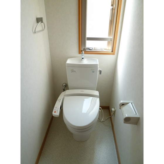 Toilet. Restroom is equipped with warm water washing toilet seat.