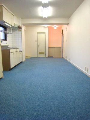 Living and room. It is a photograph of another room