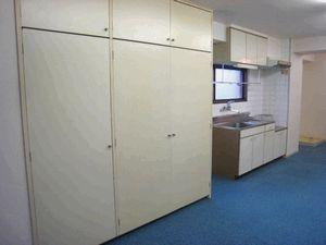Living and room. It is a photograph of another room