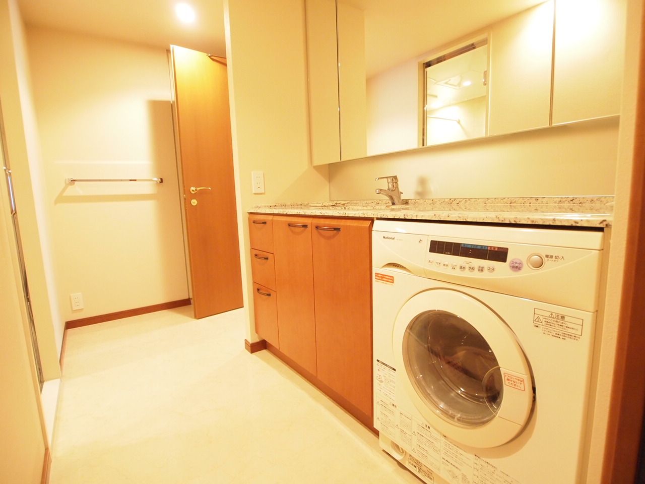 Washroom. Drum-type washing and drying machine Installed. Large mirror is characterized by.