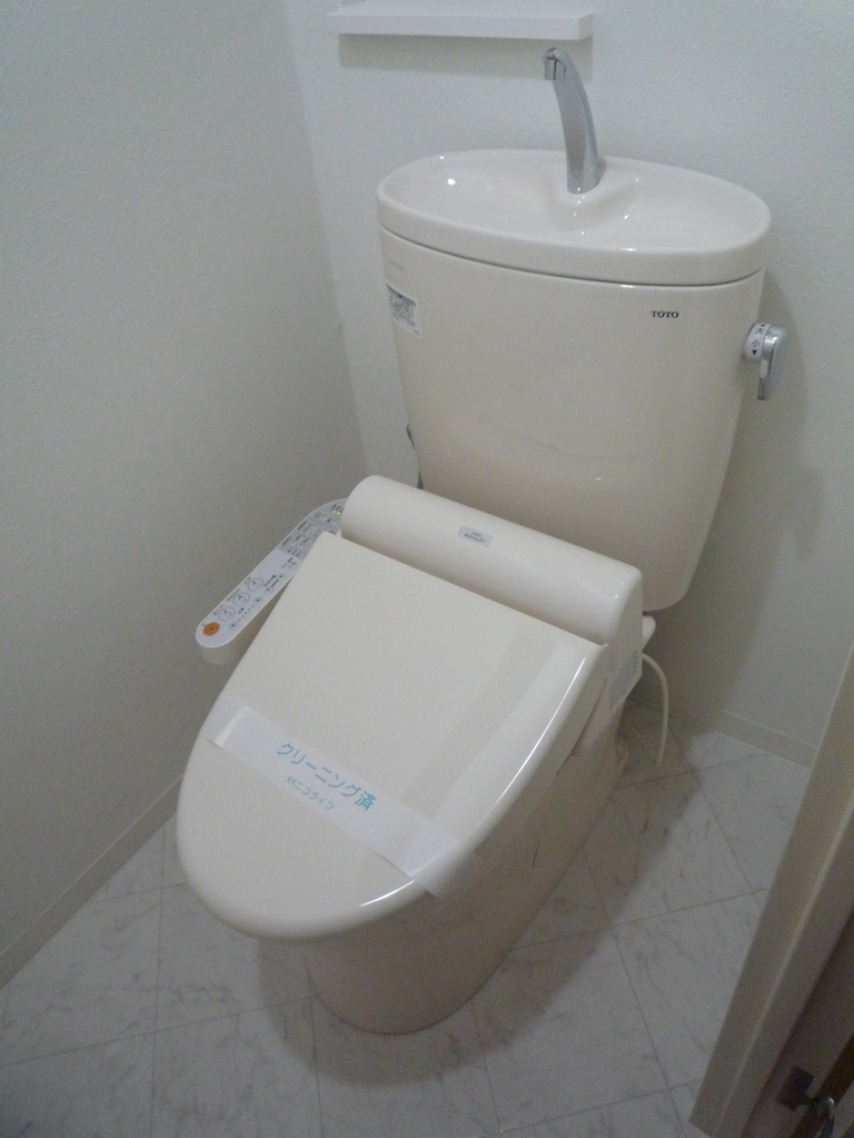 Toilet. Warm water washing toilet seat. May 2013 new exchange