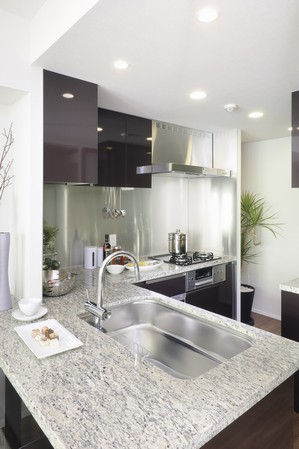 Kitchen with beautiful counter tops with granite emits a presence