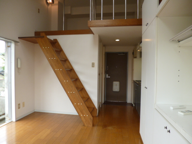 Living and room. Staircase with loft