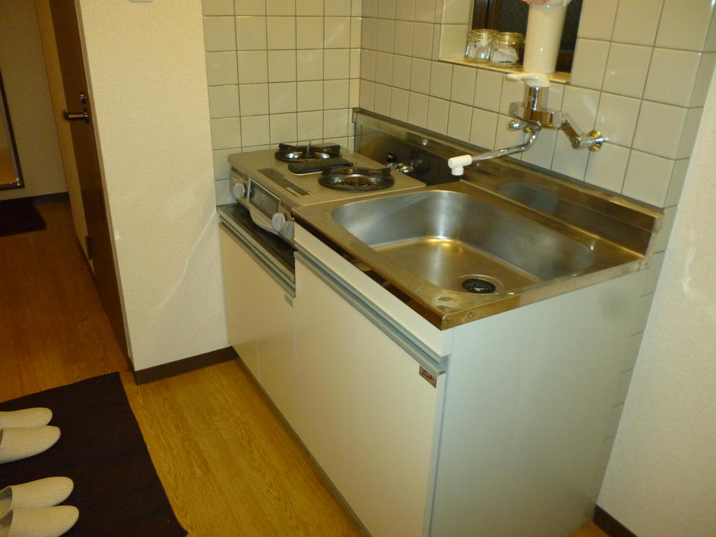Kitchen. It is a gas stove 2-neck