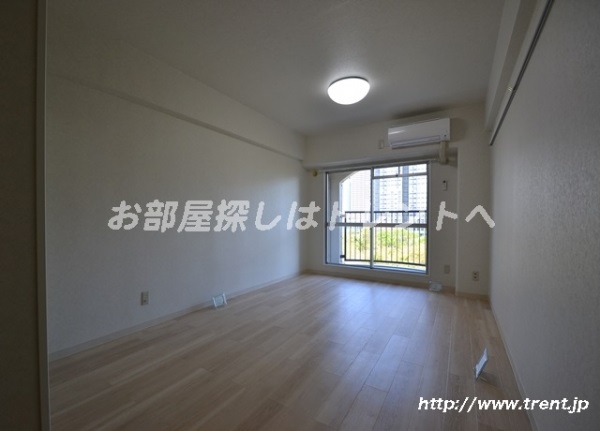 Living and room. It is a photograph of the same building by Room No.. Please see for reference.