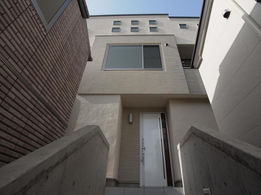 Local appearance photo. Entrance door was poised and beefier if go up the stairs