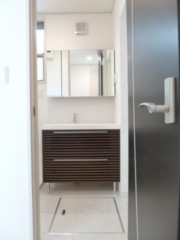 Wash basin, toilet. There is under-floor storage