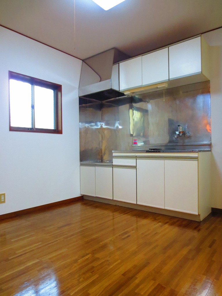 Living and room. It is bright because there is a dining kitchen window