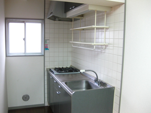 Kitchen. It is bright because there is a window to put a two-burner stove