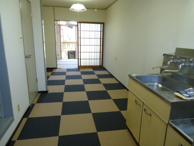 Living and room. Carpet was laid in a checkered pattern is I cute retro!