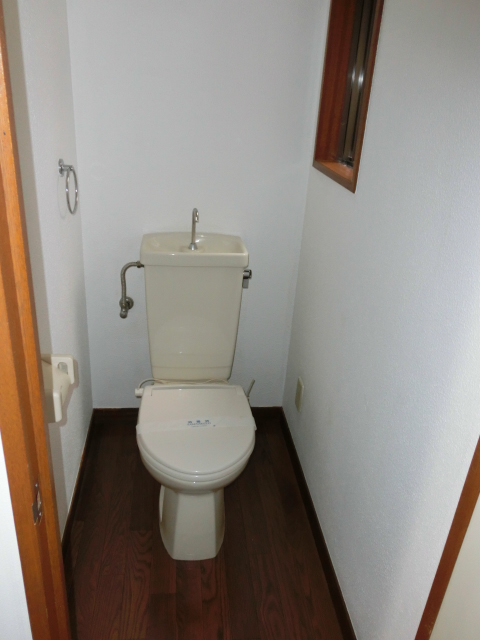 Toilet. Temperature regulation is a feature with a toilet seat