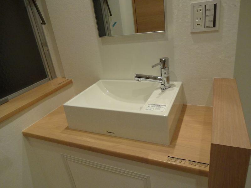 Wash basin, toilet. Bathroom vanity