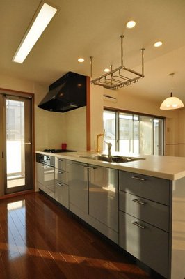 Kitchen. Next to the kitchen is full of brightness there is a door