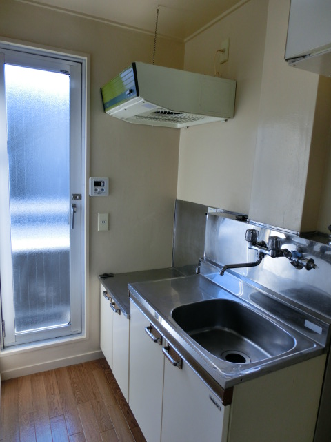 Kitchen. Bright kitchen there is a door to the veranda!