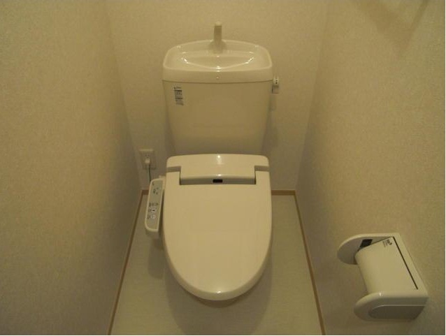 Toilet. It is a warm water washing toilet seat. 