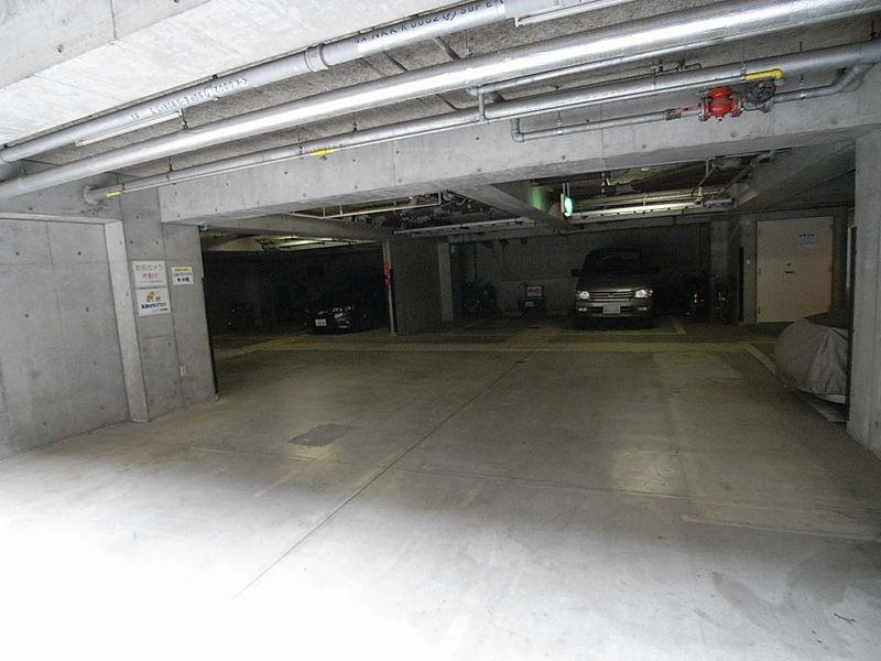 Parking lot. There is parking in the building, Security worry