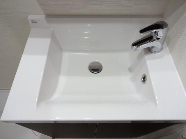 Wash basin, toilet. Bathroom vanity