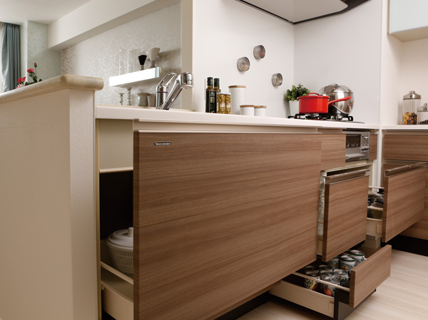 Kitchen.  [Sliding storage capable of storing a variety of dishes equipment] Adopt a sliding housed in the kitchen. Easy, such as cookware and tableware is out, It leverages without waste space further in skirting slide with storage.