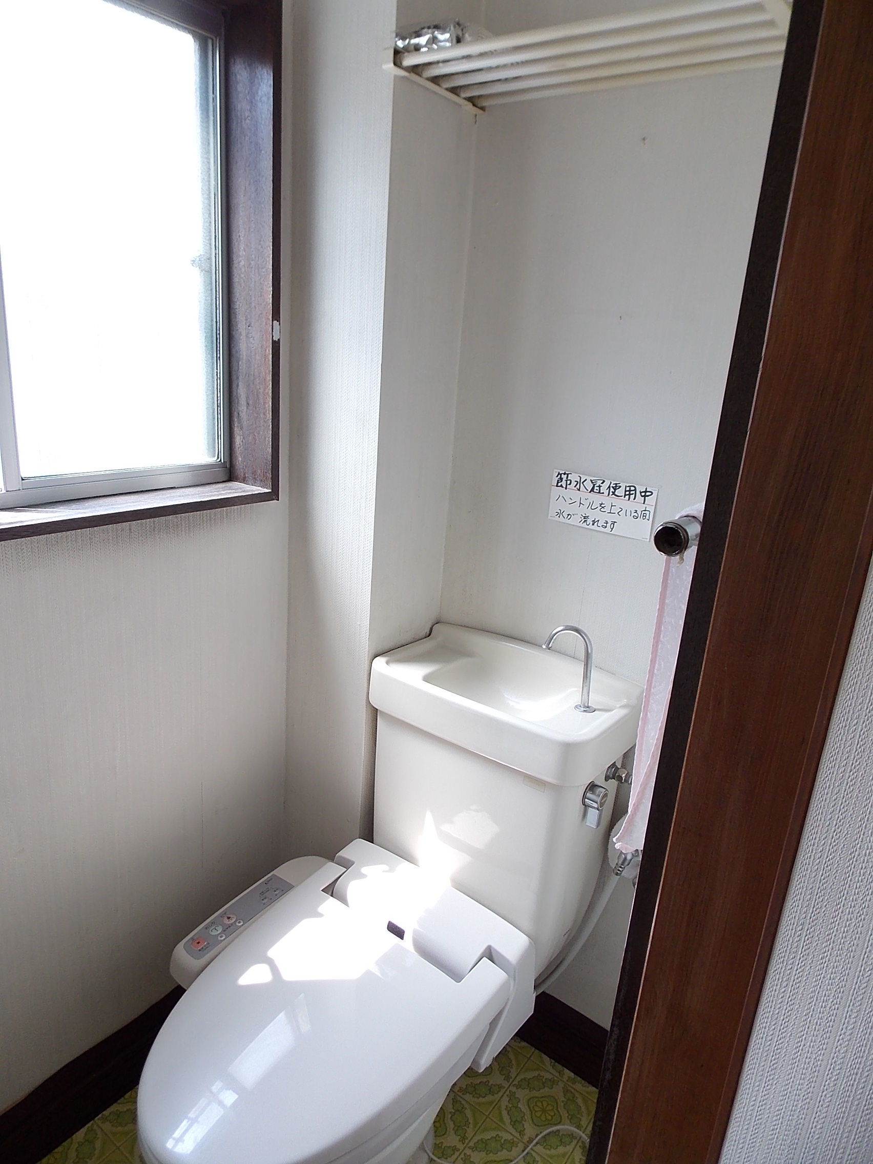 Toilet. There is warm water washing toilet seat