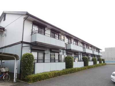 Building appearance. Balcony before has become on-site parking