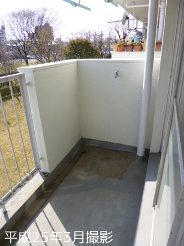 Balcony. Washing machine storage is veranda.