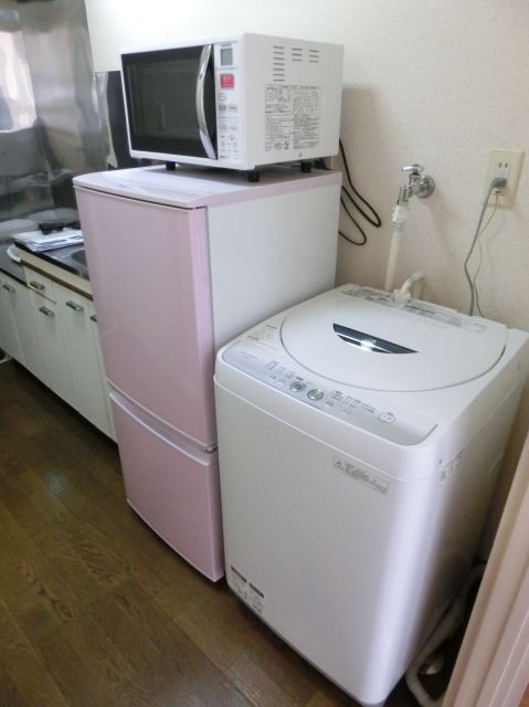 Washroom. Washing machine in the room is fully equipped. 