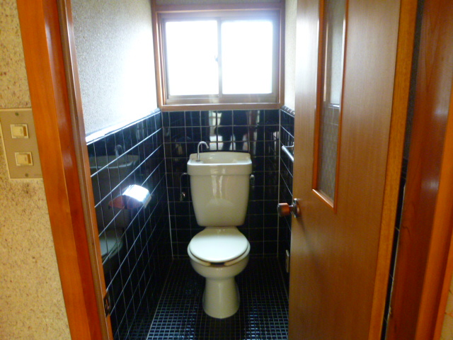 Toilet. It has a window in the toilet