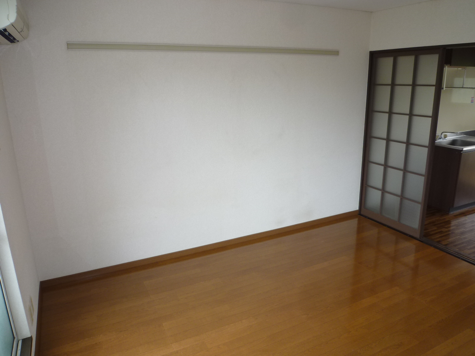 Other room space. Bulkhead. There is a sliding door between the kitchen and the living room!