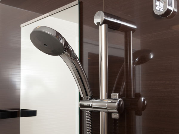 Bathing-wash room.  [Switch with a spray shower and slide bar] It is with a convenient switch the shower can stop water at hand. Also, It can be adjusted to suit the position of the shower head in the back of a height, Adopted a slide bar.
