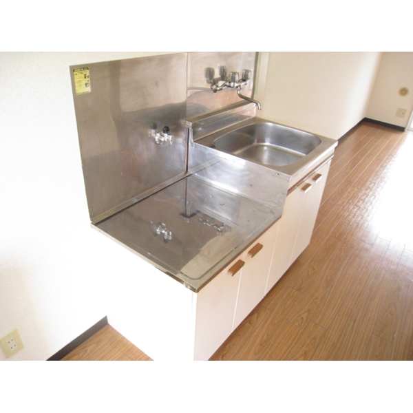 Kitchen. Two-burner gas stove installation type of kitchen. There is a refrigerator storage. 