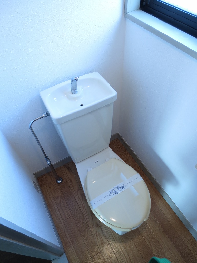 Toilet. It is bright and there is a window