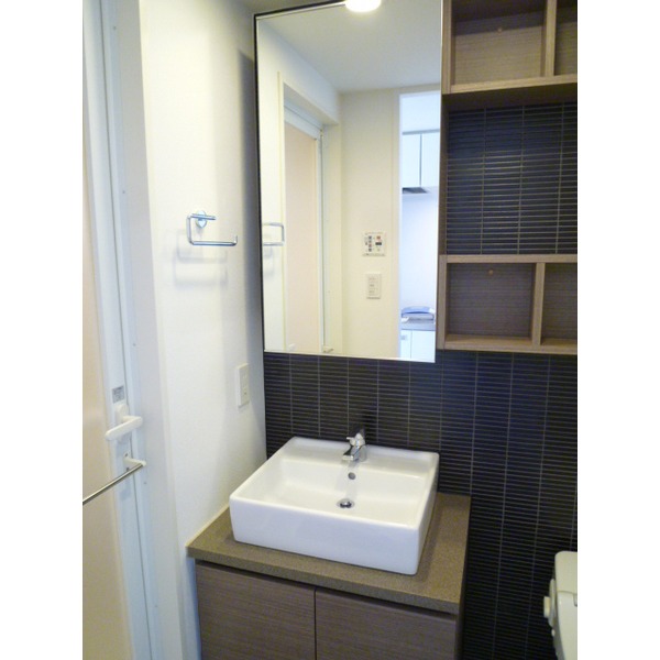 Washroom. The photograph is a separate, Room