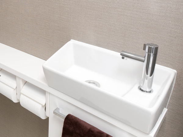 Bathing-wash room.  [Toilet with hand washing counter] The toilet, It has established a style of hand washing counter loaded with compact hand wash basin on top of the counter. I felt a wide and clear even to the eye, Easy-to-use design in a compact.