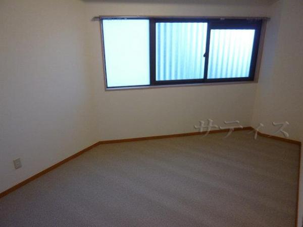 Non-living room. There is a window is bright rooms