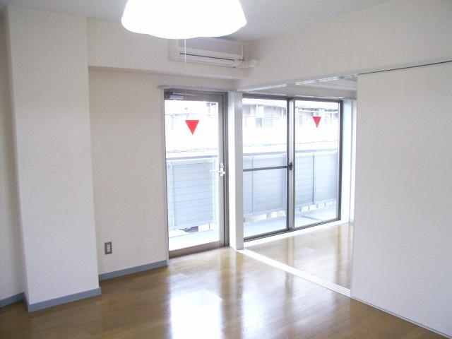 Living and room. It is a bright room with two-sided lighting