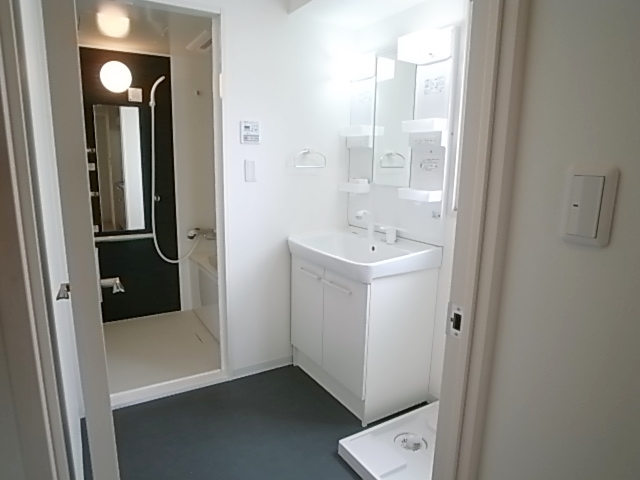 Washroom. There is a washing machine yard to wash undressing room. Bright impression with window.