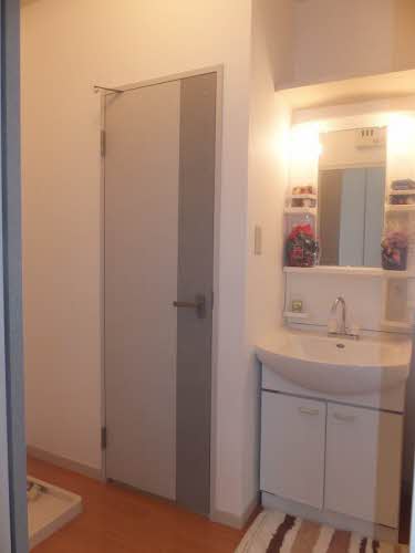 Washroom. There is a wall shelf storage on the vanity. Corridor - washroom the partition in the sliding door