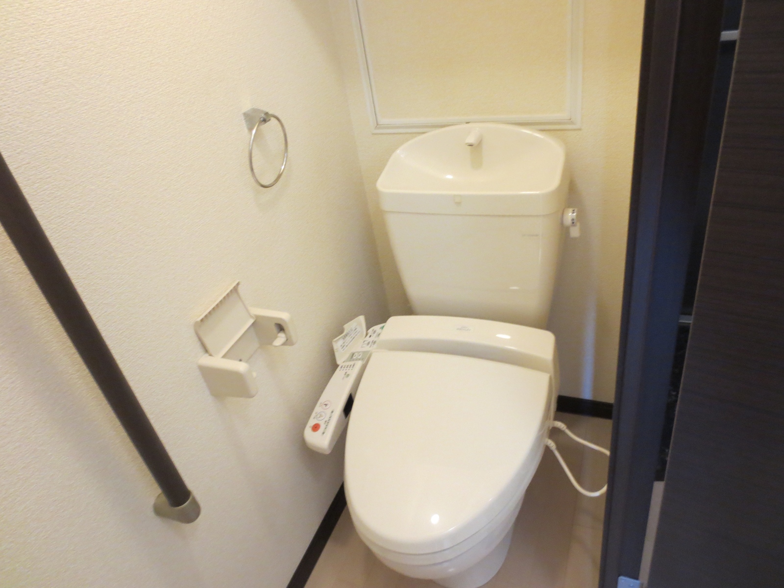 Toilet. Happy Washlet & is a handrail with a private toilet