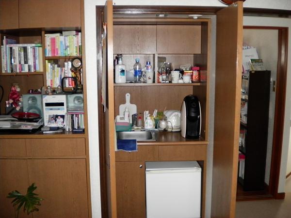 Non-living room. The bedroom has a mini-kitchen that hide