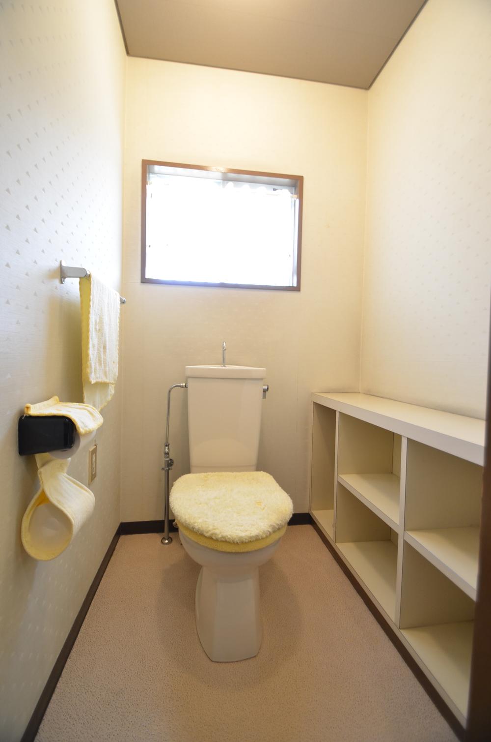 Toilet. You can use the top of the storage box as a space to put the goods and flowers.