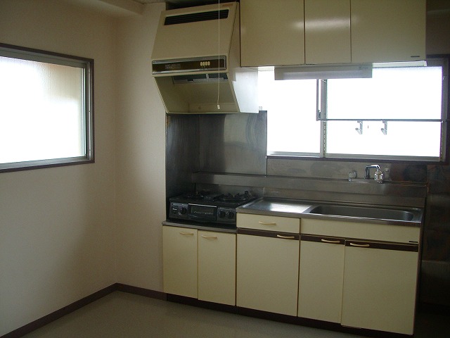 Kitchen. There is a bright, clean appearance because there is a window